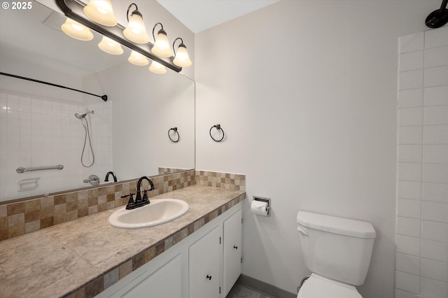 full bath with toilet, vanity, baseboards, a shower, and backsplash