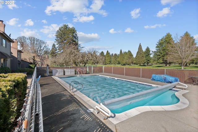 view of pool with a patio area, fence, and a fenced in pool