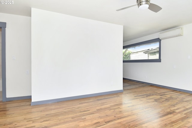 9936 SE Steele St, Portland, OR 97266 - empty room with an AC wall unit, wood finished floors, and ceiling fan