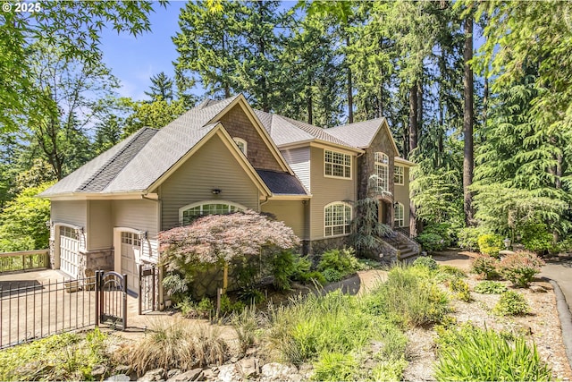 17677 Westview Dr, Lake Oswego, OR 97034 - view of front of property featuring stone siding, a shingled roof, and a gate