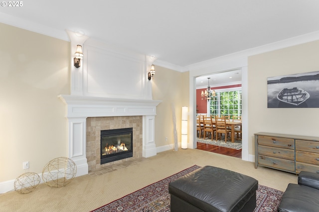 17677 Westview Dr, Lake Oswego, OR 97034 - living room with carpet, ornamental molding, a chandelier, a tile fireplace, and baseboards