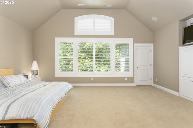 17677 Westview Dr, Lake Oswego, OR 97034 - bedroom with multiple windows, lofted ceiling, light colored carpet, and baseboards