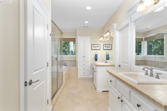 17677 Westview Dr, Lake Oswego, OR 97034 - full bath with two vanities, a bath, a shower stall, tile patterned floors, and recessed lighting