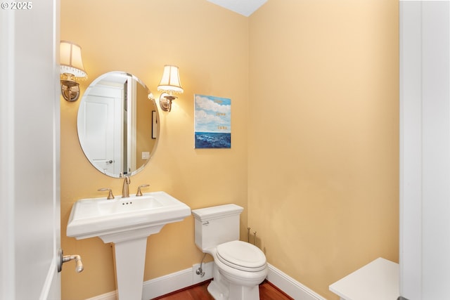 17677 Westview Dr, Lake Oswego, OR 97034 - half bath featuring toilet, wood finished floors, and baseboards