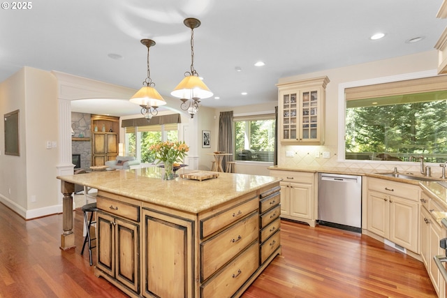 17677 Westview Dr, Lake Oswego, OR 97034 - kitchen with dishwasher, cream cabinetry, a sink, glass insert cabinets, and light wood-style floors