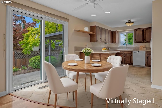 dining space with ceiling fan, recessed lighting, baseboards, and light tile patterned floors