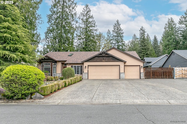 24788 E Mckenzie Valley Ct, Welches, OR 97067 - ranch-style home featuring driveway, stone siding, fence, and an attached garage