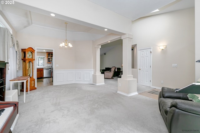 24788 E Mckenzie Valley Ct, Welches, OR 97067 - living room featuring a chandelier, recessed lighting, ornate columns, and light colored carpet