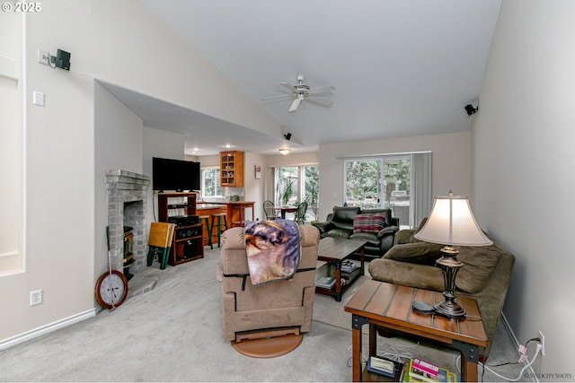 24788 E Mckenzie Valley Ct, Welches, OR 97067 - living room featuring baseboards, vaulted ceiling, a fireplace, ceiling fan, and carpet