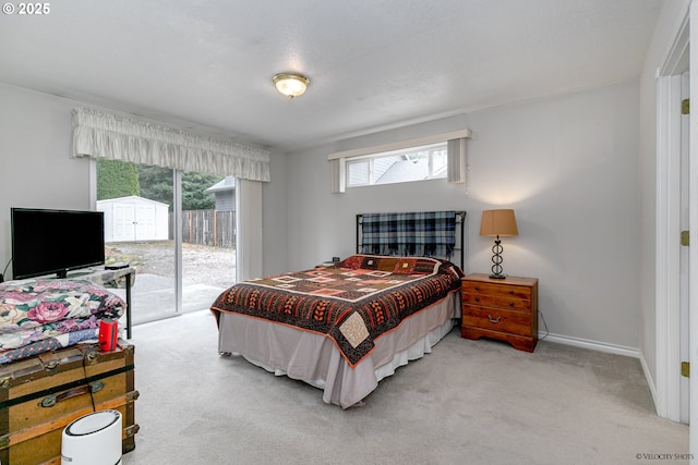 24788 E Mckenzie Valley Ct, Welches, OR 97067 - carpeted bedroom with access to exterior and baseboards