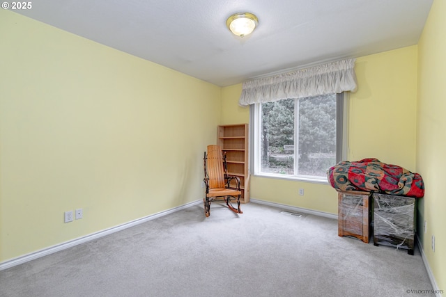 24788 E Mckenzie Valley Ct, Welches, OR 97067 - living area with baseboards, visible vents, and carpet floors