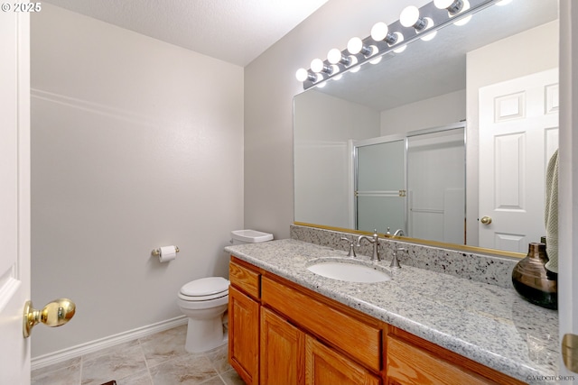 24788 E Mckenzie Valley Ct, Welches, OR 97067 - full bathroom with toilet, vanity, baseboards, and a stall shower