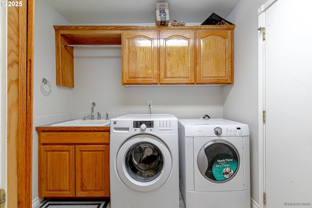 24788 E Mckenzie Valley Ct, Welches, OR 97067 - washroom with cabinet space, independent washer and dryer, and a sink