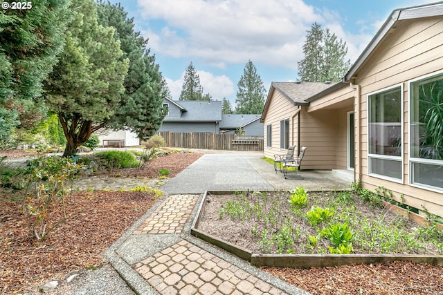 24788 E Mckenzie Valley Ct, Welches, OR 97067 - view of yard featuring a vegetable garden, fence, and a patio