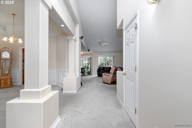 24788 E Mckenzie Valley Ct, Welches, OR 97067 - hall featuring a notable chandelier, carpet, and a wainscoted wall