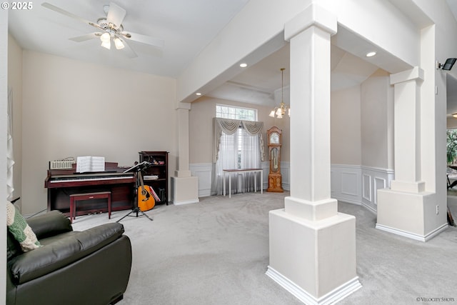 24788 E Mckenzie Valley Ct, Welches, OR 97067 - living area featuring a decorative wall, a wainscoted wall, decorative columns, and carpet flooring