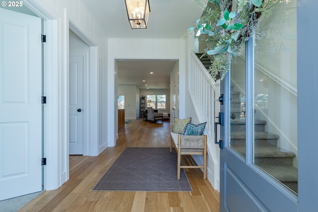 entrance foyer featuring a notable chandelier and light wood-type flooring