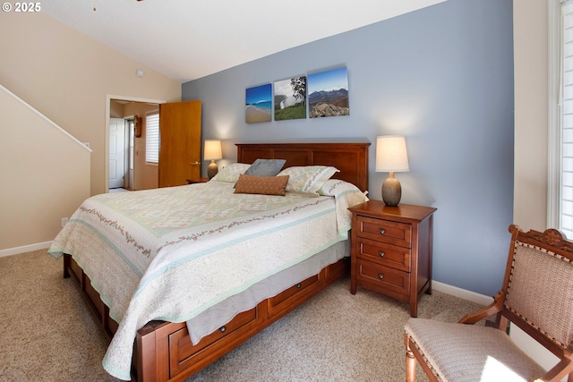 carpeted bedroom with vaulted ceiling