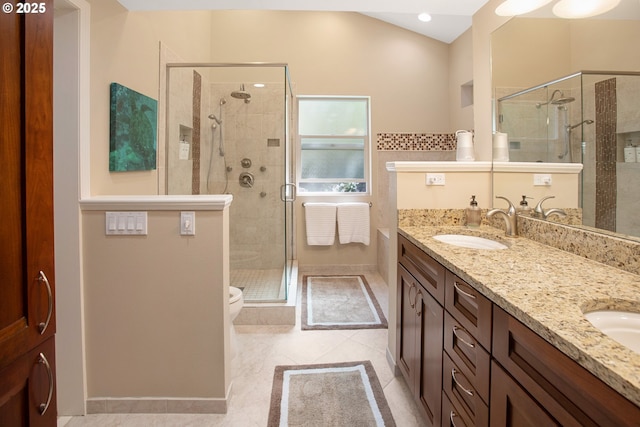 bathroom with lofted ceiling, vanity, toilet, a shower with door, and tile patterned floors