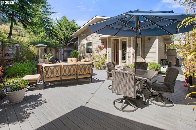 wooden deck featuring outdoor lounge area