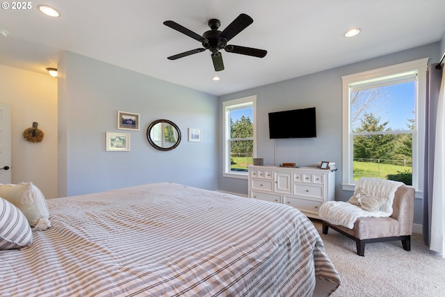 bedroom with recessed lighting, a ceiling fan, and light carpet