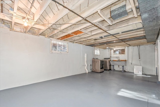 basement featuring sink and washing machine and clothes dryer