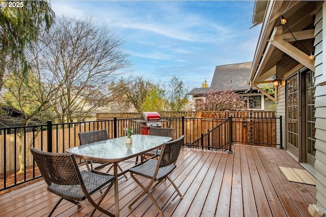 wooden deck with grilling area