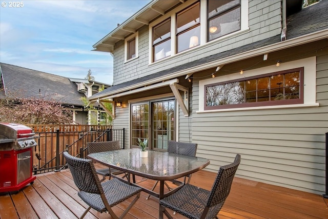 wooden terrace featuring grilling area