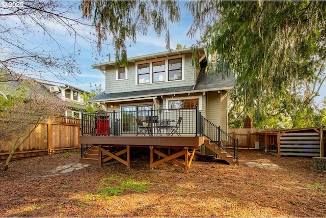 back of property featuring a wooden deck