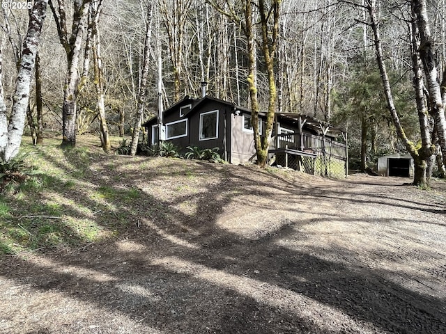 exterior space featuring a forest view