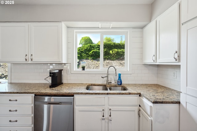 kitchen featuring a sink, white cabinets, stainless steel dishwasher, backsplash, and light stone counters