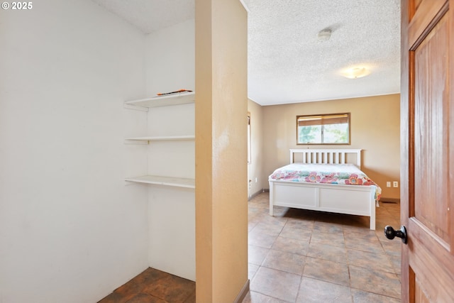 bedroom featuring a textured ceiling