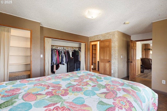 bedroom featuring a closet, a textured ceiling, and wood finished floors