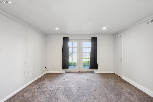 carpeted empty room featuring crown molding, recessed lighting, baseboards, and french doors