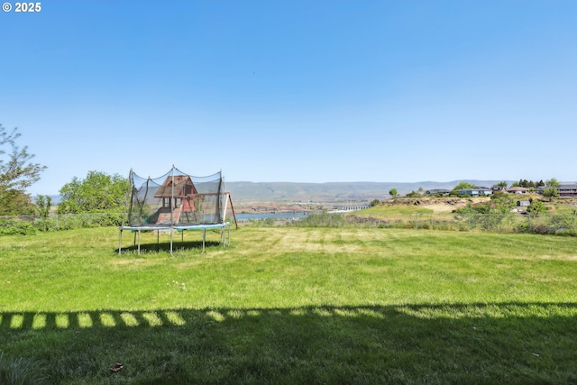 view of yard with a trampoline