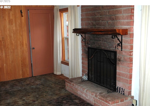unfurnished living room featuring a fireplace and carpet flooring