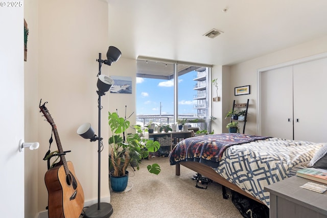 carpeted bedroom with visible vents