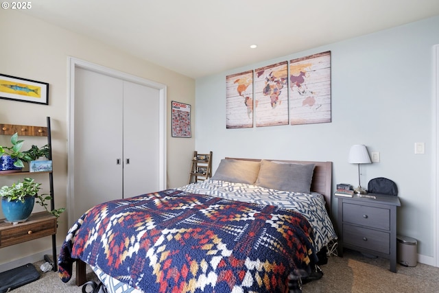 carpeted bedroom featuring a closet, baseboards, and recessed lighting