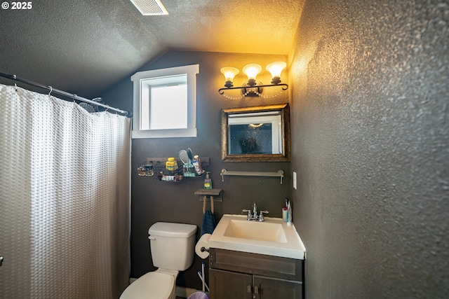 full bath featuring lofted ceiling, a textured ceiling, toilet, vanity, and a textured wall