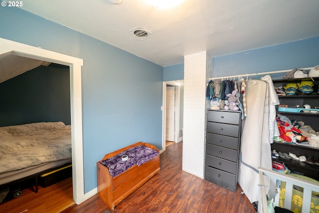 bedroom featuring wood finished floors