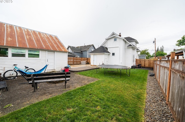 view of yard with an outbuilding and a patio