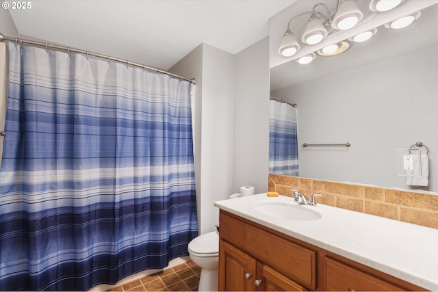 bathroom featuring vanity, tile patterned floors, toilet, and walk in shower