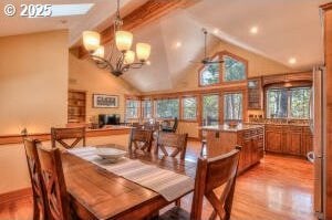 dining space with light wood-type flooring, beam ceiling, high vaulted ceiling, and a notable chandelier