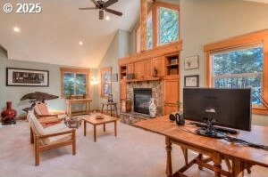 living room featuring a fireplace with raised hearth, ceiling fan, plenty of natural light, and high vaulted ceiling