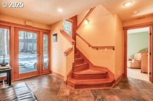 doorway featuring baseboards, stairway, and recessed lighting