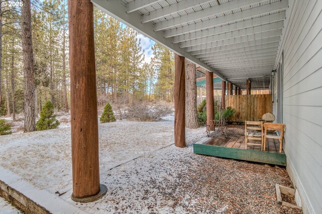 view of yard with fence and a wooden deck