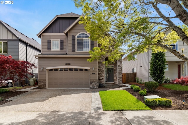 6244 SE Jess Ct, Hillsboro, OR 97123 - view of front of house with an attached garage, board and batten siding, stone siding, and concrete driveway
