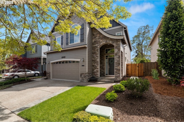 6244 SE Jess Ct, Hillsboro, OR 97123 - traditional-style home with concrete driveway, fence, stone siding, and a garage