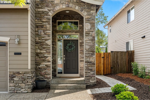 6244 SE Jess Ct, Hillsboro, OR 97123 - doorway to property with fence and stone siding
