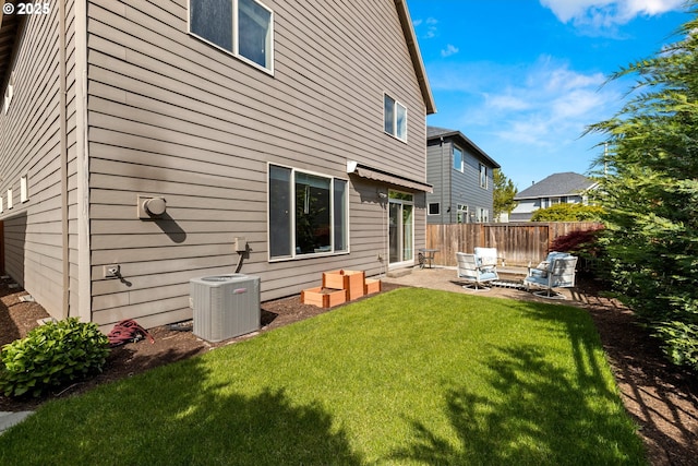 6244 SE Jess Ct, Hillsboro, OR 97123 - rear view of property with fence, central AC, an outdoor hangout area, a patio area, and a yard